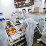 Vietnam logs additional 14,224 COVID-19 cases hinh anh 1