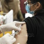 Vietnam records 163,174 new COVID-19 infections on March 18 hinh anh 1