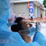 Vietnam sees 16,325 COVID-19 infections on December 21 hinh anh 1