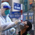 COVID-19 downgraded to Group B infectious disease hinh anh 1